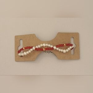 Red & pearl gold swirl bracelet with gold accents